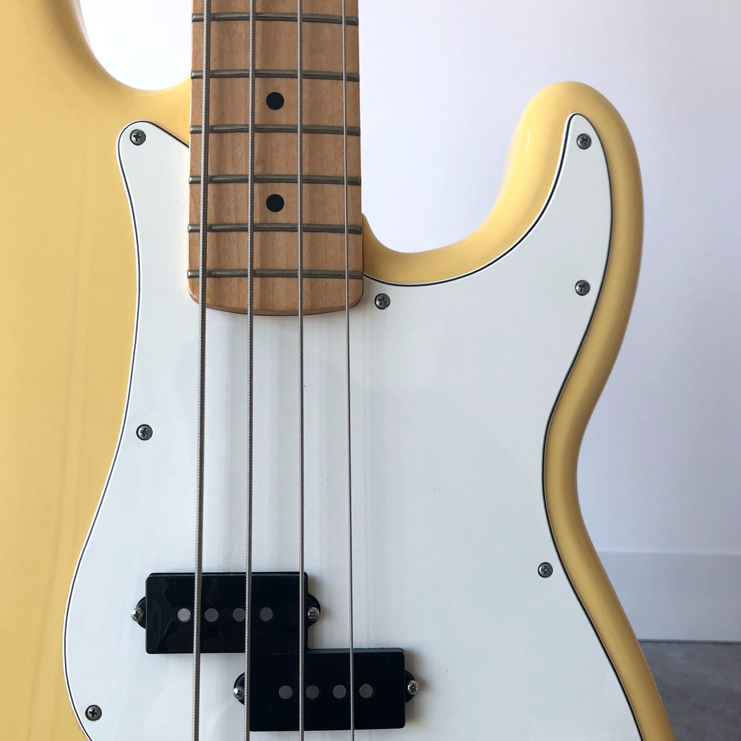 Yellow and black electric guitar